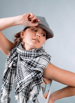 Hip hop female performing on  gray background