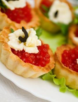   Canapes with red caviar   . Shallow depth-of-field