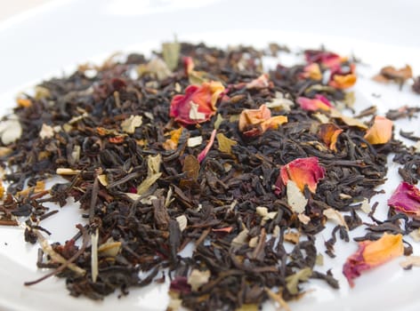  tea with petal of the rose and sunflower,in studio shoton white background 