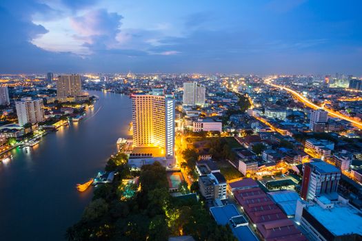 Aerial view of Bangkok Skyline along Chaophraya River at dusk