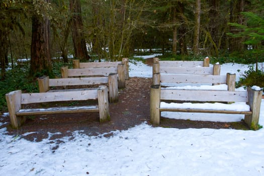 Wooden benches were built by hand and placed in this wooded setting to create an ampitheater with seating.