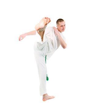   capoeira dancer posing  over white background 