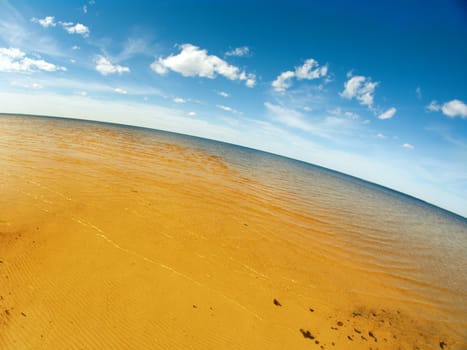 coast White Sea .Wave of water and sand 