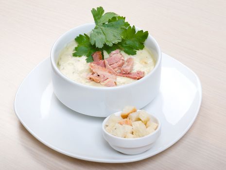 vegetable cream soup with smoked meat  close up 