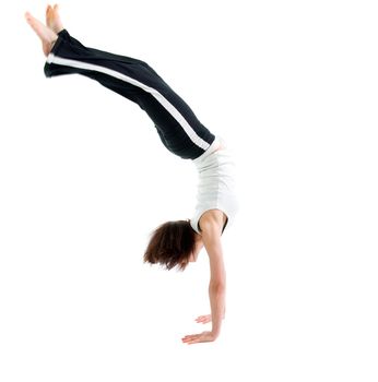 girl  capoeira dancer posing  over white background 