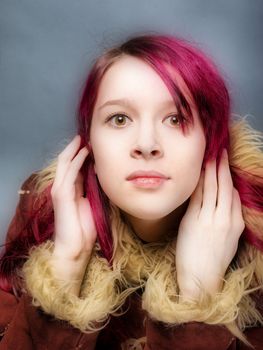 Emo look   girl with red hair on  gray background