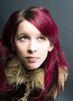 Emo look   girl with red hair on  gray background