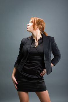 fashion portrait of a red hair sexy woman, studio shot 