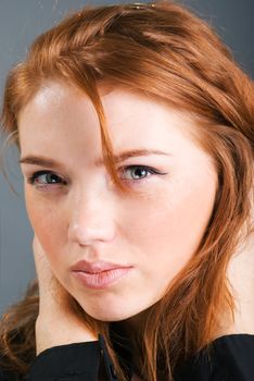 fashion portrait of a red hair sexy woman, studio shot 