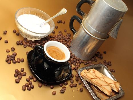 an espresso cup moka napoletana and cookies