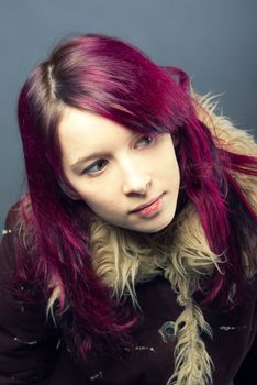 Emo look   girl with red hair on  gray background