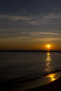 a sunrise on the beach of barcellona