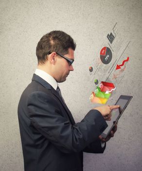 Businessman analyzing a chart on a tablet