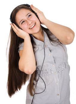 young girl happily listening to music on headphones