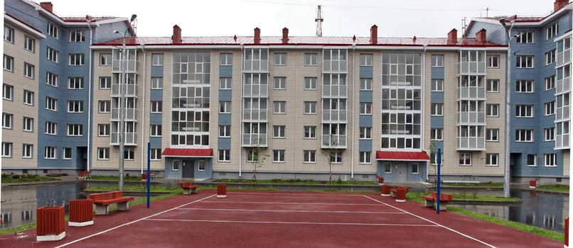 view of modern house with a sports ground