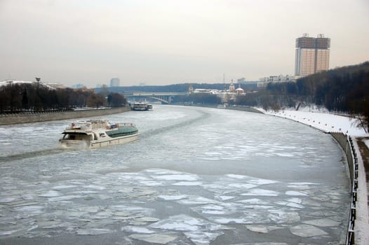 Ship at winter ice river, Moscow city, Russian Federation
