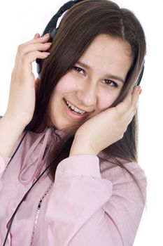 Woman with eyes closed listening to music on headphones.