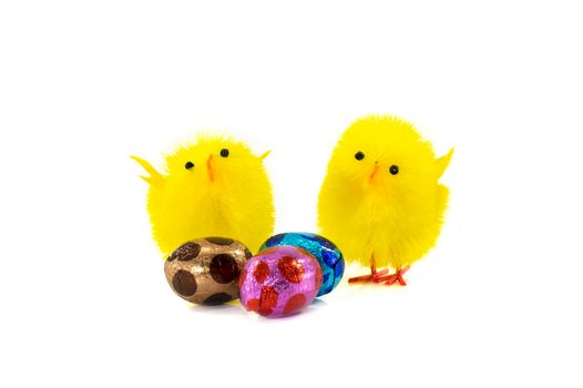 yellow easter duck and eggs in pink brown blue