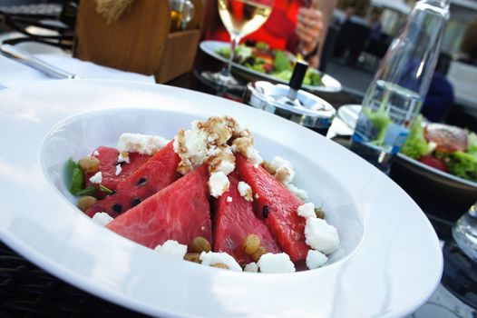 Water-melon salad served in the white plate         