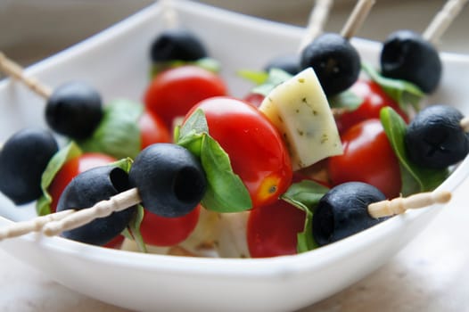 Olives and cherry tomatoes on the stick
            