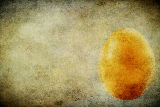 The egg on the old brown paper. Grunge