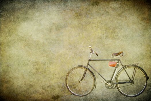 The old bicycle on the old brown paper