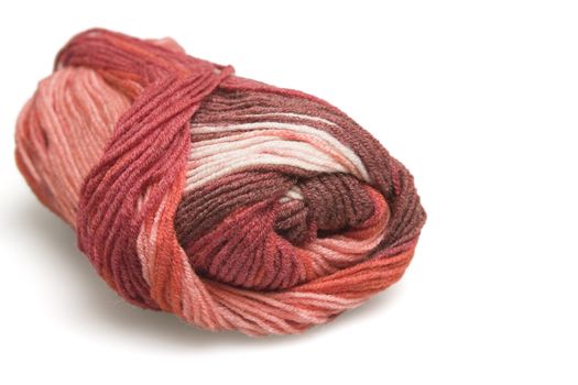 skein of wool in red on a white background