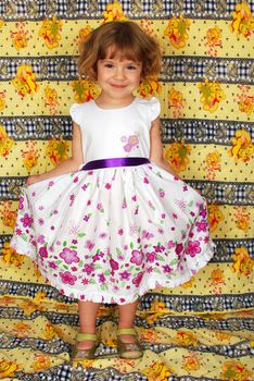 Beautiful little girl in white dress studio shot
