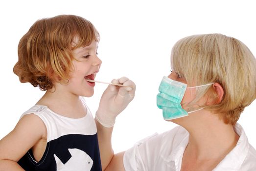 Doctor examines throat in little girl patient