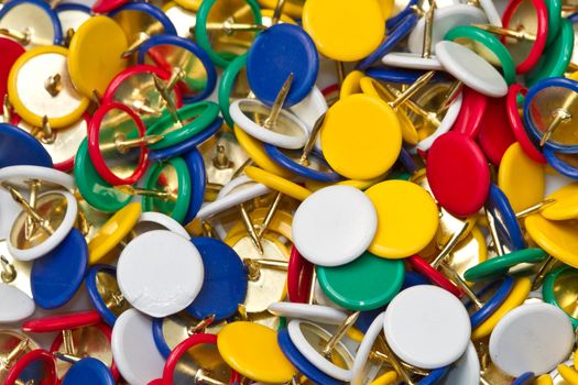 a group of colored pushpins