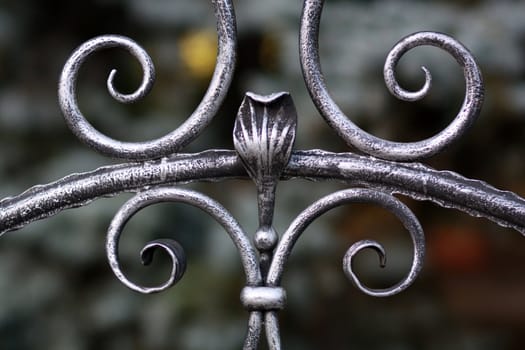 A fragment of metal forged lattices with swirls