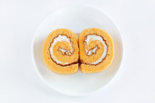 roll cake with cream on white