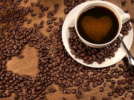 coffee beans and cup of coffee with a heart