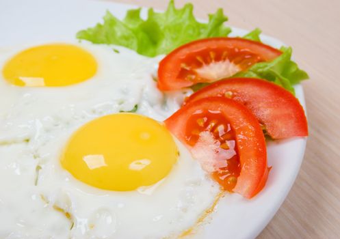 Delicious egg with vegetable close up .morning meal