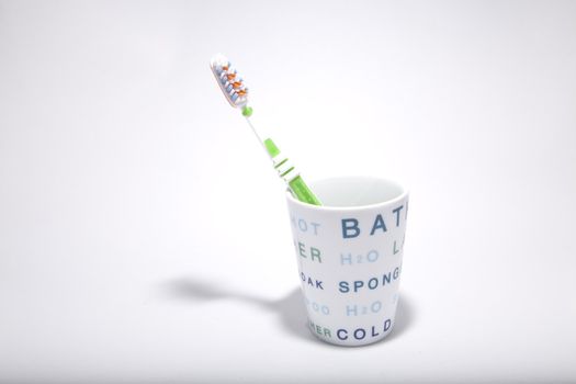 one toothbrush into one cup