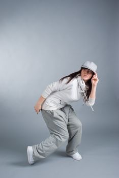 modern style dancer posing on  gray background 