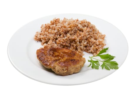 chops with buckwheat on plate.isolated on white background