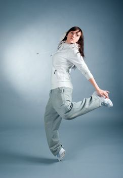 modern style dancer posing on  gray background 