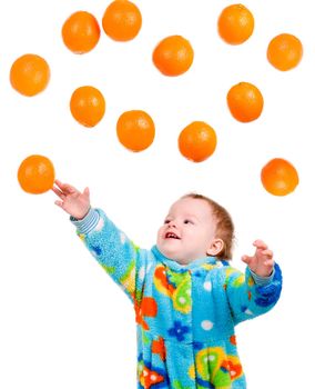 Little baby girl caughts orange .isolated on white background