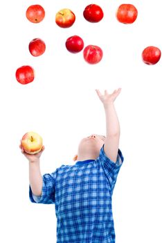 Little boy  caughts flying apple  .isolated on white background