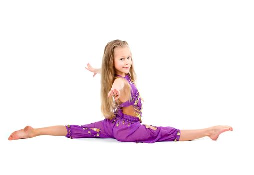  young girl doing gymnastics over white 