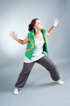 modern style dancer posing on  gray background 