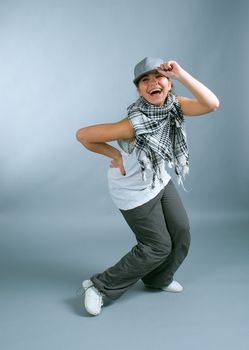 Hip hop female performing on  gray background