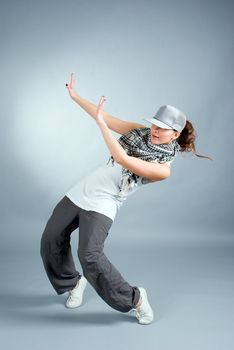 Hip hop female performing on  gray background