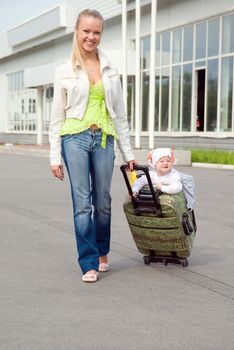 girl and child in valise.family goes to travel