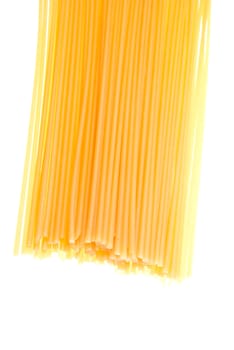 uncooked spaghetti noodles isolated on a white background.