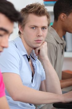 Three students in university lecture