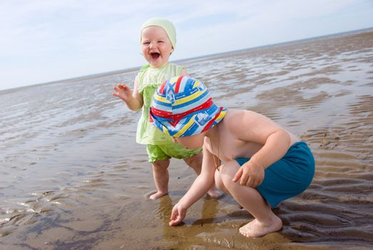 kids playing at the beach .White Sea