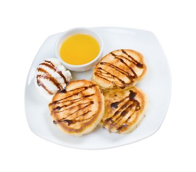 morning meal.pancakes with icecream and honey.isolated on a white background.