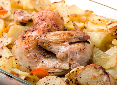 Potato with a hen on grill .Whole Roast chicken